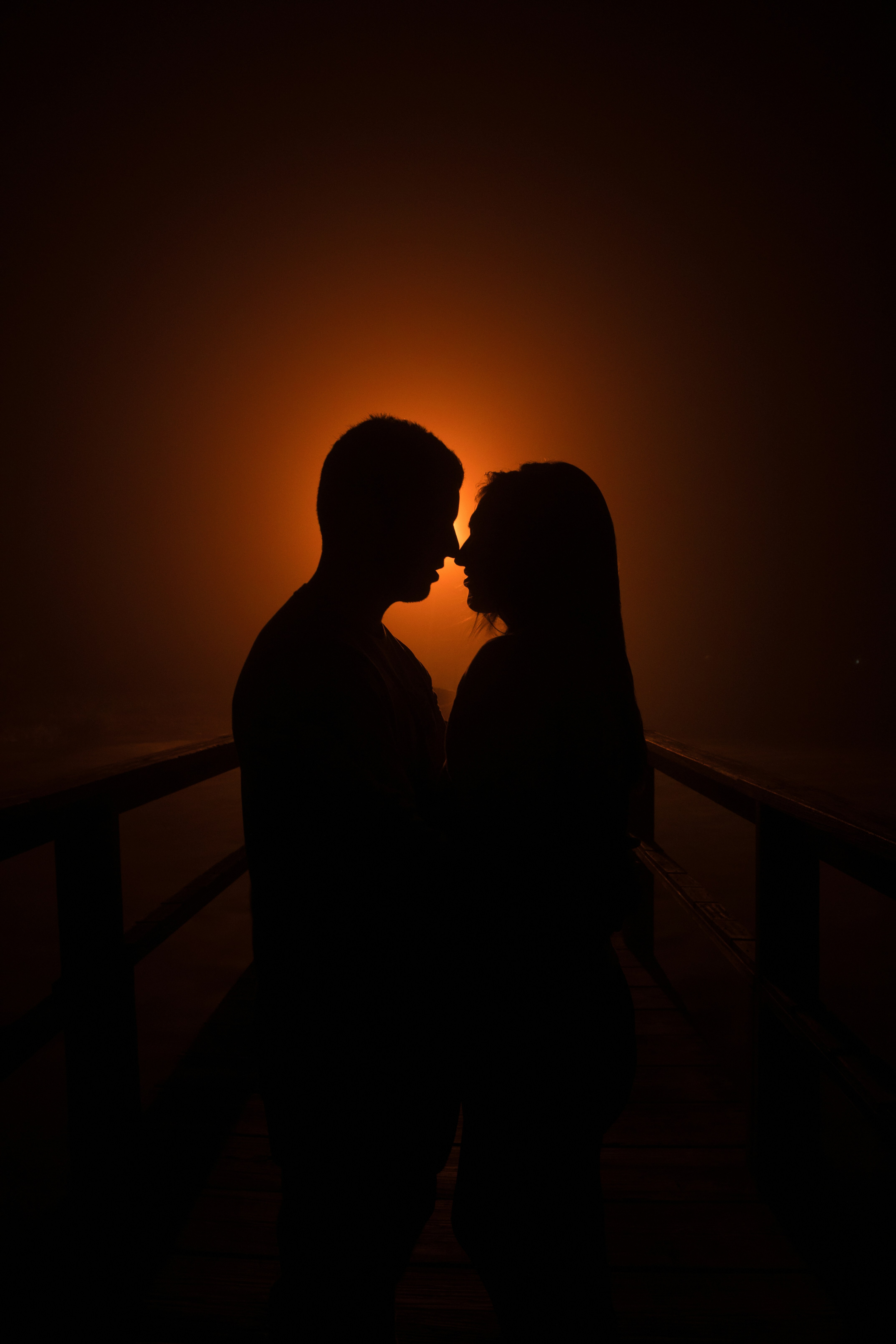 Couple silhouette, warm orange glow